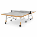 Tavolo da ping pong pieghevole in mdf grigio con struttura in acciaio e ruote